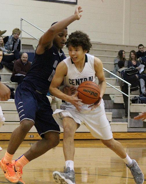 Robby B, senior, drives to the basket in a loss against Oswego East on Jan. 27.