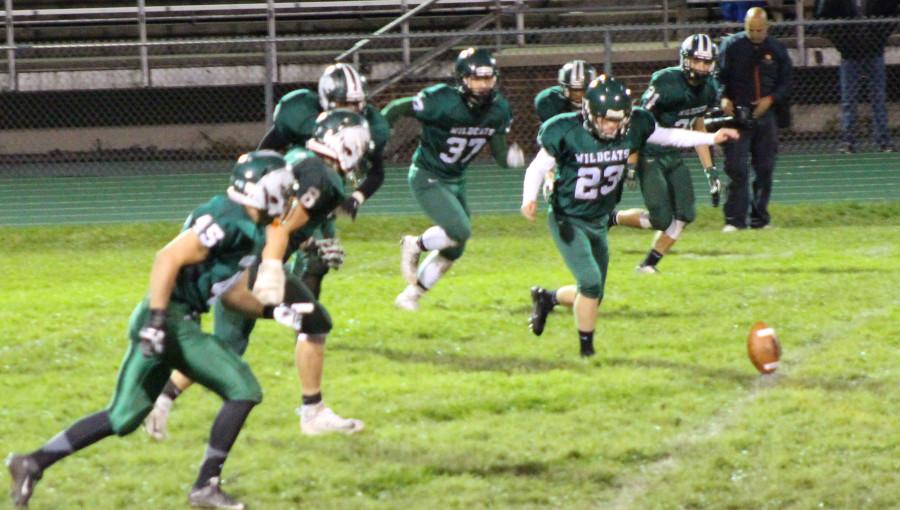 Jarod  Petrovic, senior, kicks off to start the game that ended in a 43 - 13 loss against Oswego on Sept. 11. 