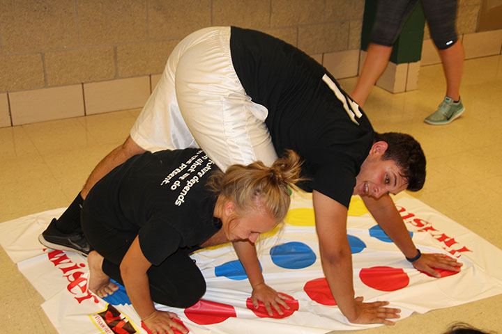 Freshmen students played twister as one of the many games featured during the Freshmen Mixer.