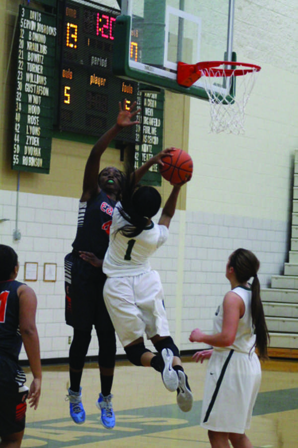 Senior Hennessey Handy goes up for a layup in their loss against 
Plainfield East on Tuesday, Dec. 1. 