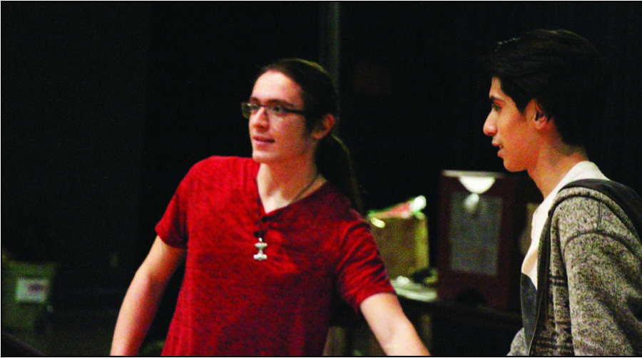 Jon Gilson, junior, and Alex Vazquez, sophomore, practice for the Madrigals performance this December. 