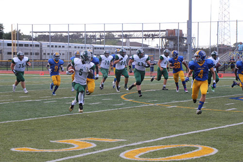 Senior, Lovell Houston  runs the football down the field in the  close game against Joliet on Friday, Sept. 16. The Wildcats lost 35-38.