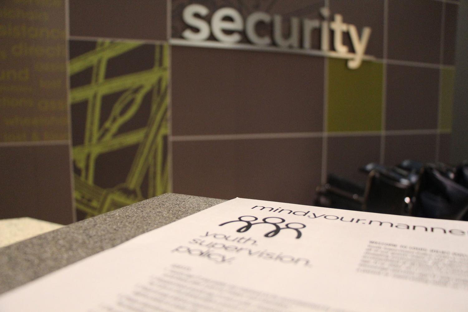 The new Youth Supervision Policy is displayed on a security desk in the Louis Joliet Mall. The policy, which prohibits minors from entering after 5p.m. without adult supervision, went into effect on Oct. 13.