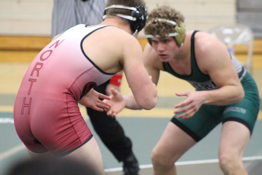 Senior Tommy Gustafson faces down his opponent in a recent match. He finished 2nd in state overall.
