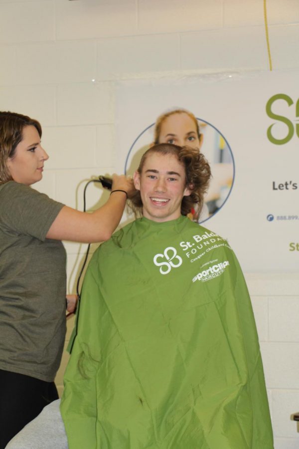 Junior Joey Kramarski  has his head shaved on March 22.