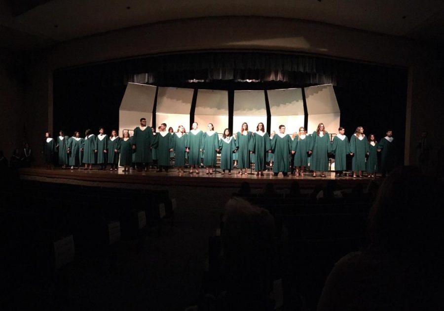 Senior choir members stand in recognition at their last choir concert on Tuesday, May 8th.