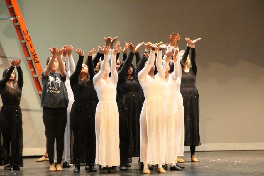 Dancers on stage show their dance moves in attempt to excite the crowd 