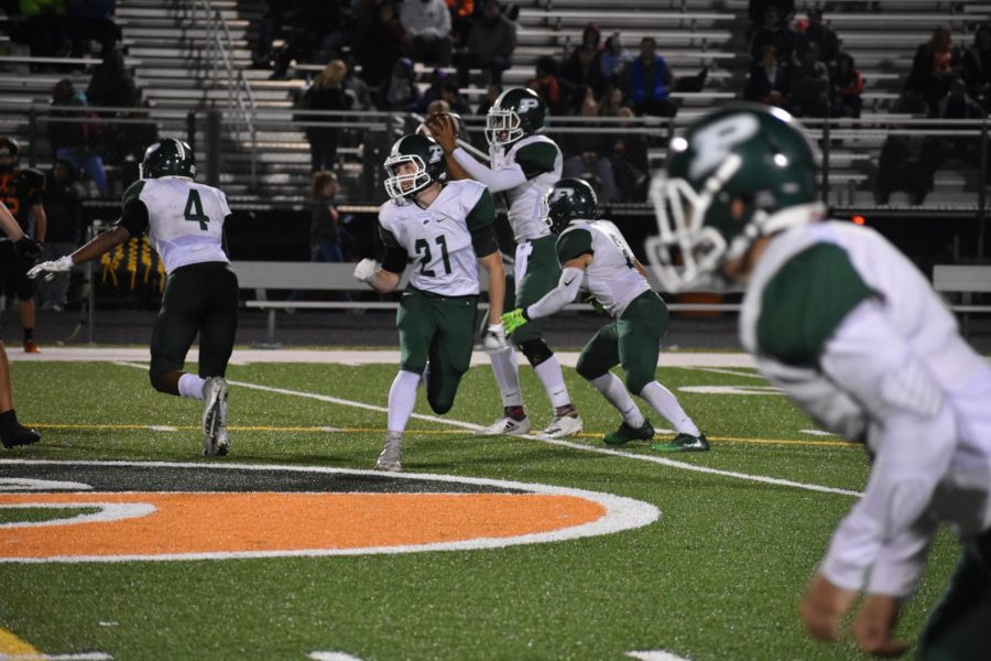 Senior Justin Lentz, #21, runs a route to get open to receive a pass from quarterback Nick Barner, senior.