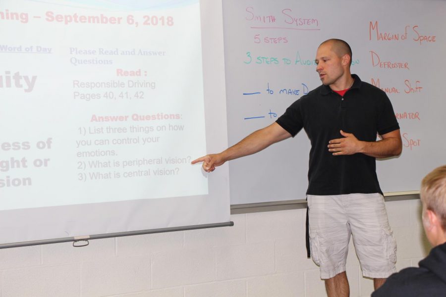 Michael Opsal, drivers ed teacher, instructs his drivers ed class. 