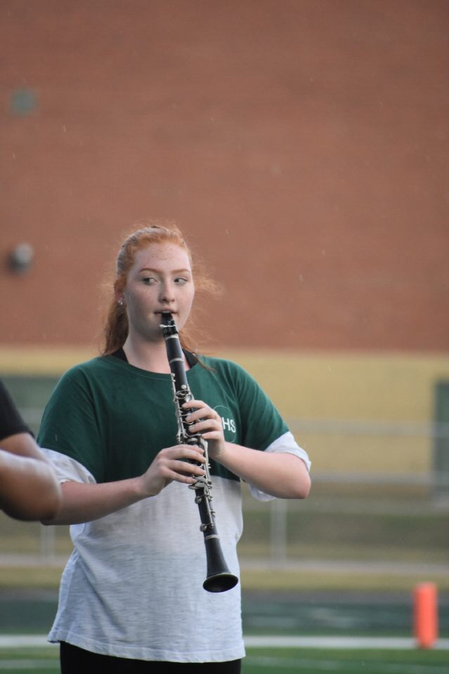 Molly Jaszczak, sophomore, moves in formation
during the band’s performance of “Double Agent” at Green and White night.