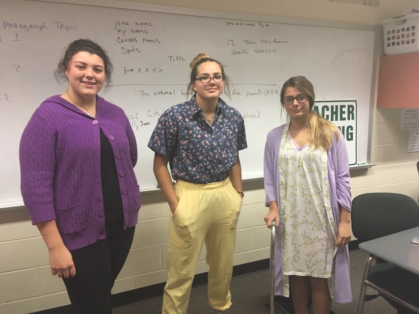 Seniors Lindsey, Olivia, and Paige dress as senior citizens for Homecoming.