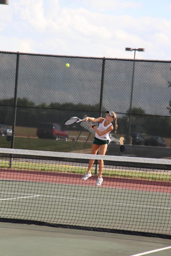 Senior Katie Kearney serves to Romeoville during the last home match of the season. The Wildcats won 7-0.