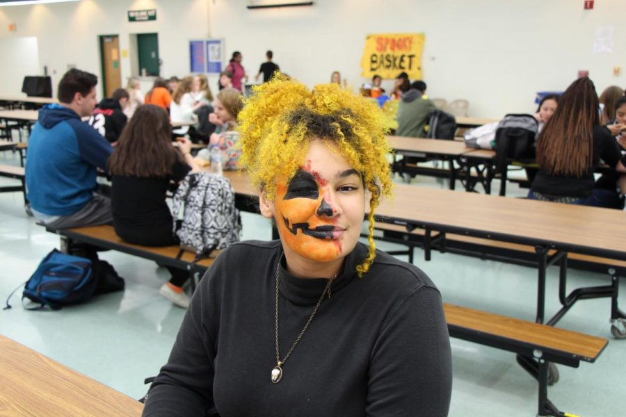 Rhiannon Woods, sophomore, sports half a jack-o-lantern face.