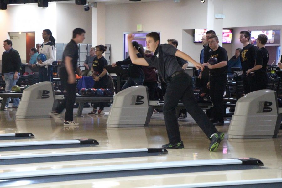 Sophomore Mason Craig bowls during the tournament against Joliet West on Tuesday, Dec. 11.  The team       obtained 2 out of 10 points, winning only the last game.