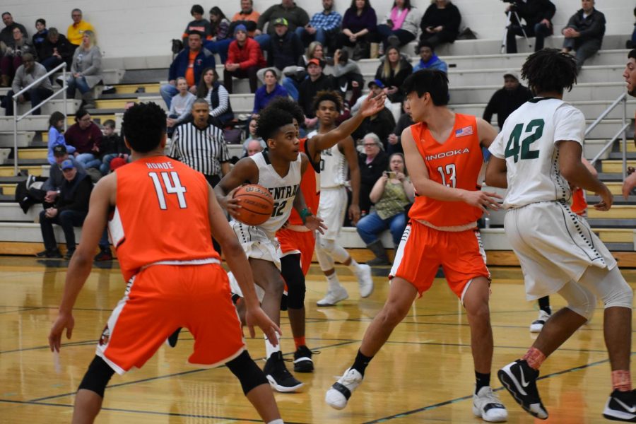 Junior+Tavari+Johnson+drives+to+the+basket+through+Minooka%E2%80%99s+defense.+The+Wildcats+won+58-56.