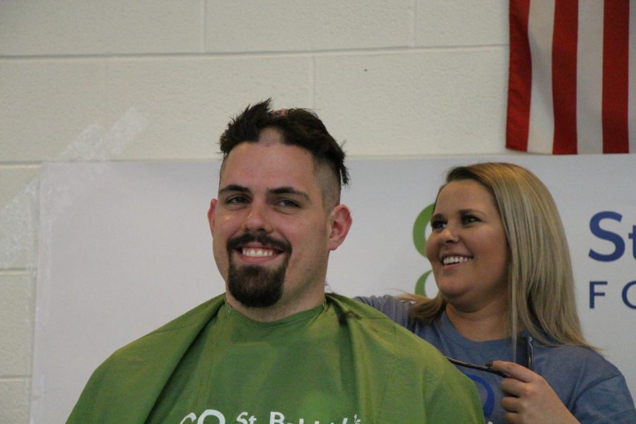 Jon Pereiro, teacher, was shaved down the center of his head, much to the amusement of the audience.