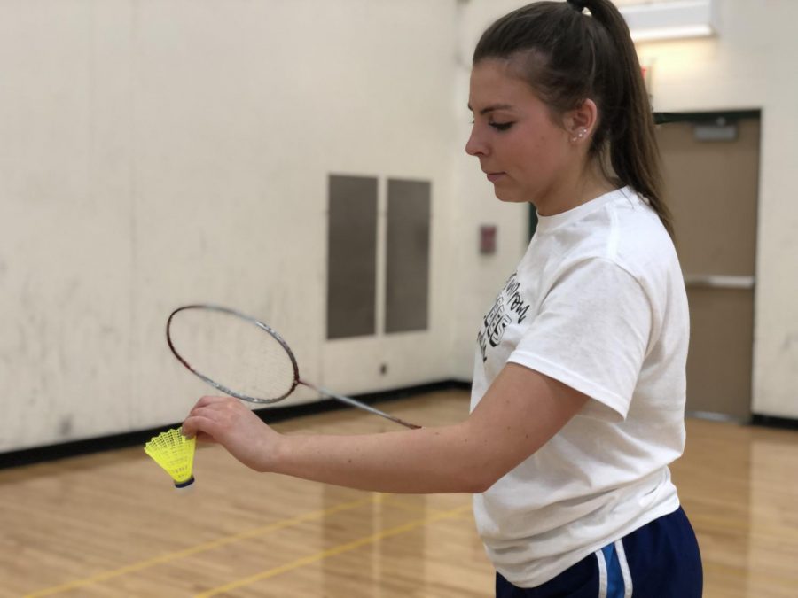 Senior+Andrea+Heagney+warms+up+her+serve+during+practice.+Their+first+game+is+on+March+19.