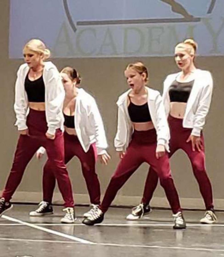 Freshman Katelynn Gazda, second from right,  performes a hip-hop 
routine with her out of school dance  troupe
