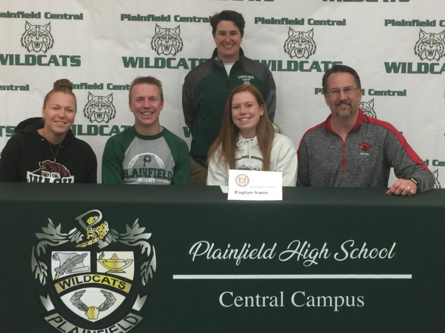 Payton Irwin (center) signed with Washington University for softball.