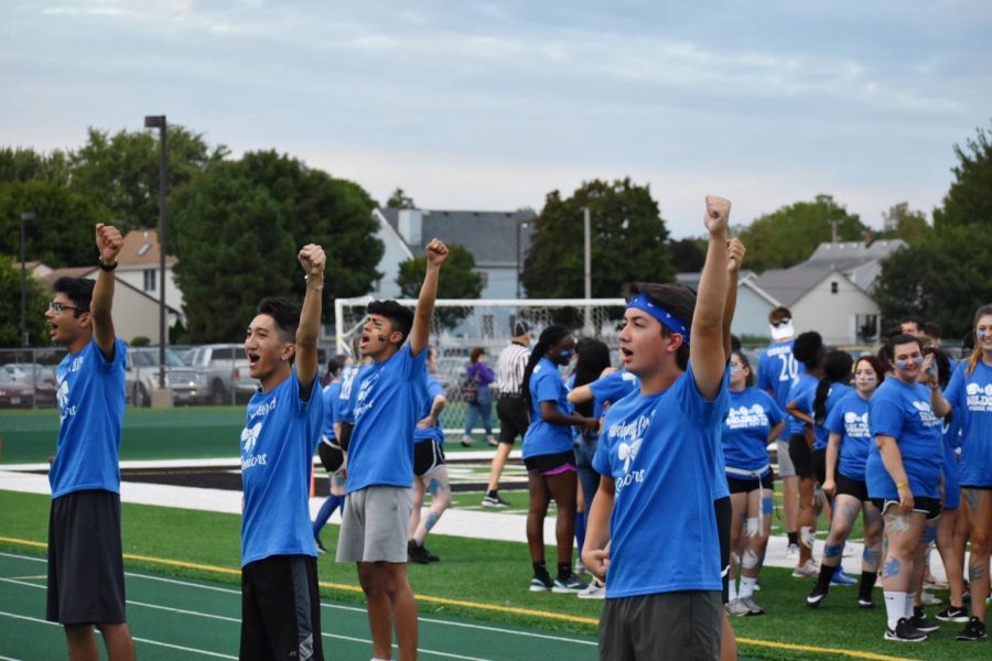 Seniors Reza Alvi, Caleb Vergara, Daniel Monroy, and Kyle Gladem warm up the crowd with cheers they practiced prior to the game.