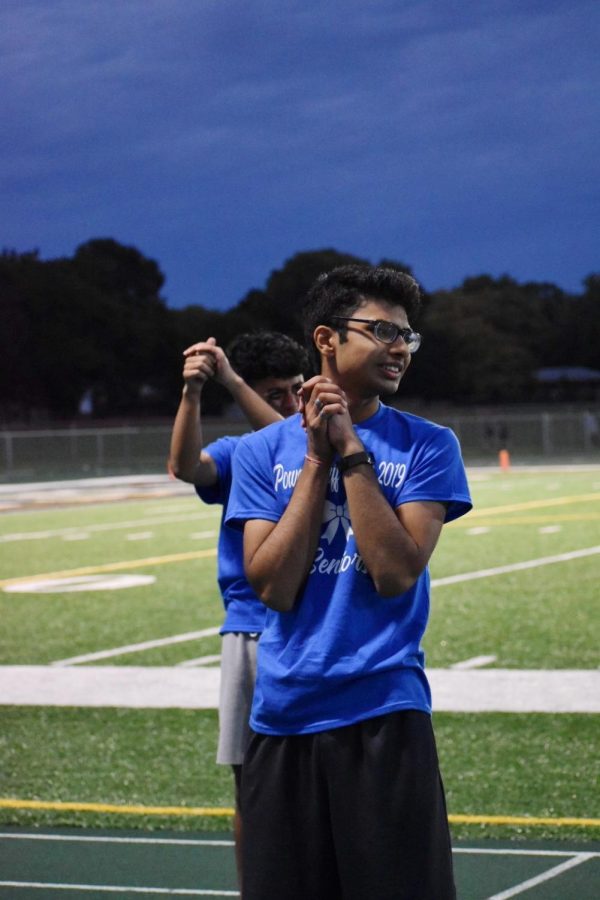 Reza Alvi, senior. cheers on the seniors during the game, rooting on the seniors as the game continues. 