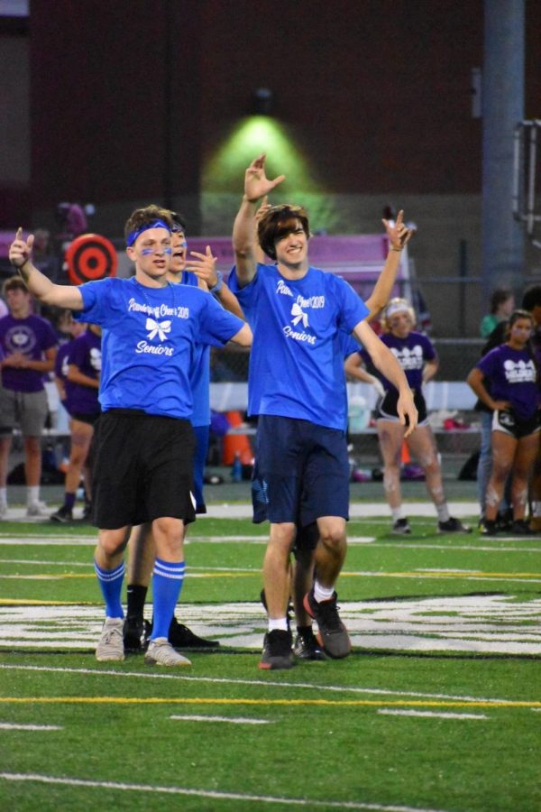 Seniors Gabe Jackson and Jackson Heritage motivate the crowd after performing at halftime. 