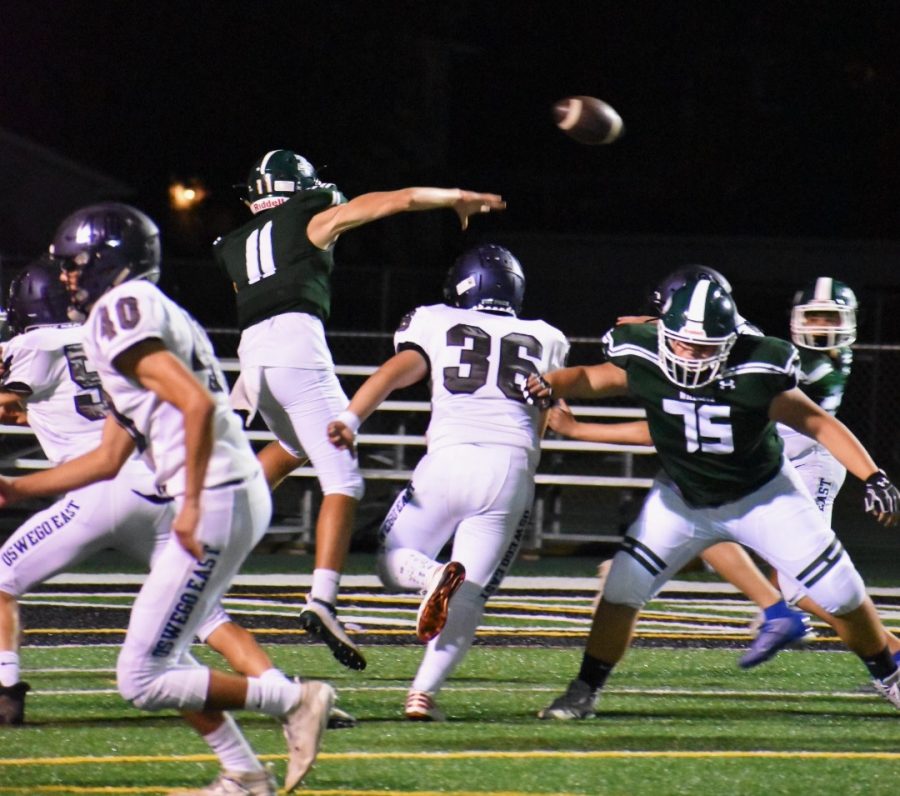 Quarterback+Chris+Leto+%28%2311%29%2C+junior%2C+throws+a+pass+to+his+teammates+in+their+loss+against+Oswego+East+7-55+on+Sept.+6.+