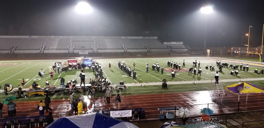 The Wildcat Marching Band prepares to perform in competition at Western Illinois University on Oct 26.