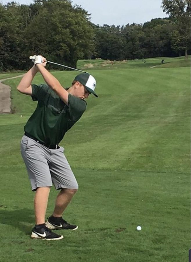 Ashton Mutnansky, junior, addresses the ball in a match at Romeoville. 