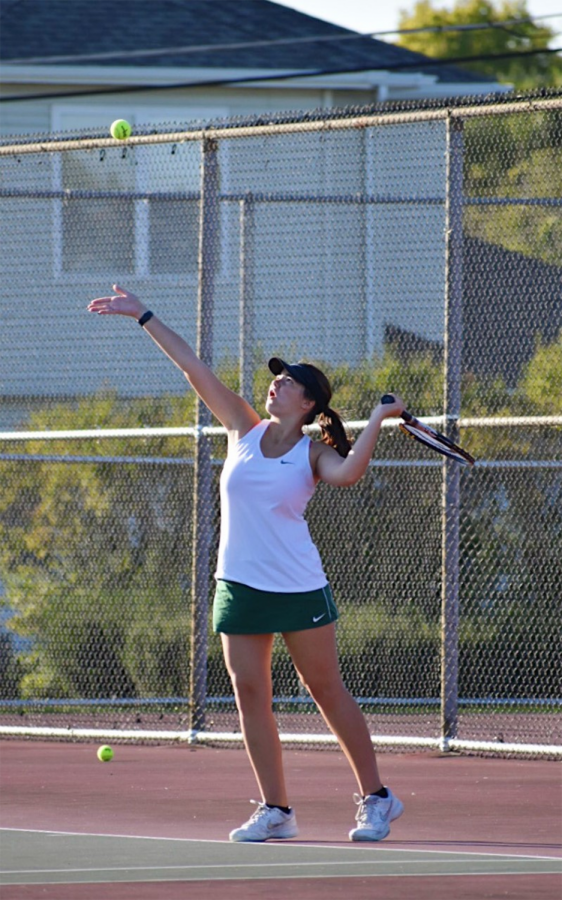 Isabel+Scudella%2C+senior%2C+serves+to+her+teammate+at++practice.+