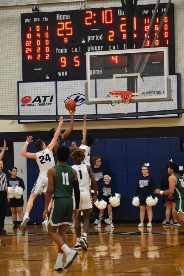 Kameron Flowers, junior, lays it in with his left hand, drawing a foul. 