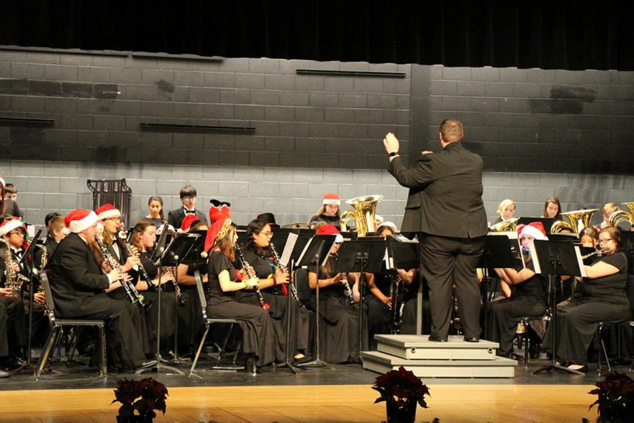Student aid director, Marc Smith, conducts the Symphonic band ensemble in a medley of John William’s Home Alone soundtrack.