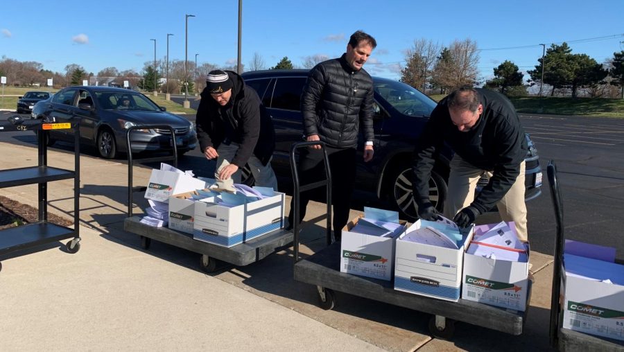 (From left) District 202 Superintendent Dr. Lane Abrell, Dave Stephens, Plainfield High School-Central Campus principal, and Dr. Glenn Wood, Assistant Superintendent of Curriculum and Instruction hand out Remote Learning packets to families on Monday, March 30, 2020 at the Administration Center, 15732 S. Howard St. 