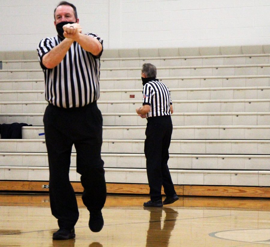 Referee calls a foul on Plainfield East as Plainfield Central leads with a score of 37-11 leading into third quarter.