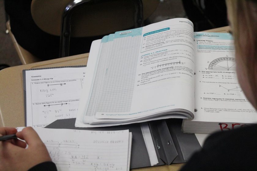 A student works in her Springboard book studying for an upcoming test. 