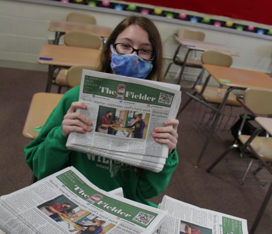 Junior Nicole Jones displays the first print edition of the Fielder for this school year.