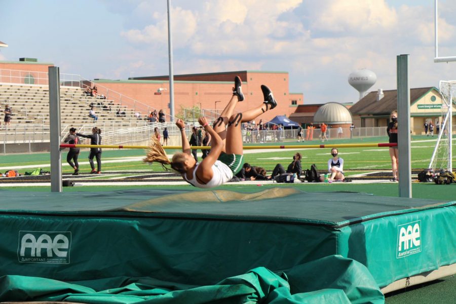 Tess Foster, junior, clears the bar in high jump at the Hunt Invitation. 