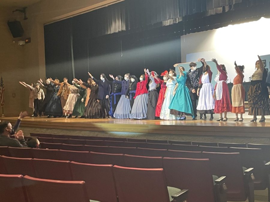 The cast of Little Women bow at the end of their final performance. 