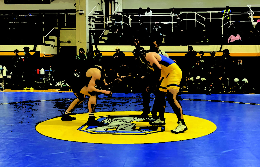 Max Bowen, class 180, faces off in a conference matchup against an opponent from Joliet Central.