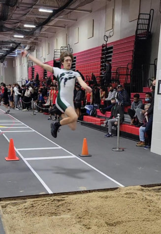 Junior James Kulekoskis competes in the long jump at the Bolingbrook invite where he jumped 4.66m, earning a sixth place finish.