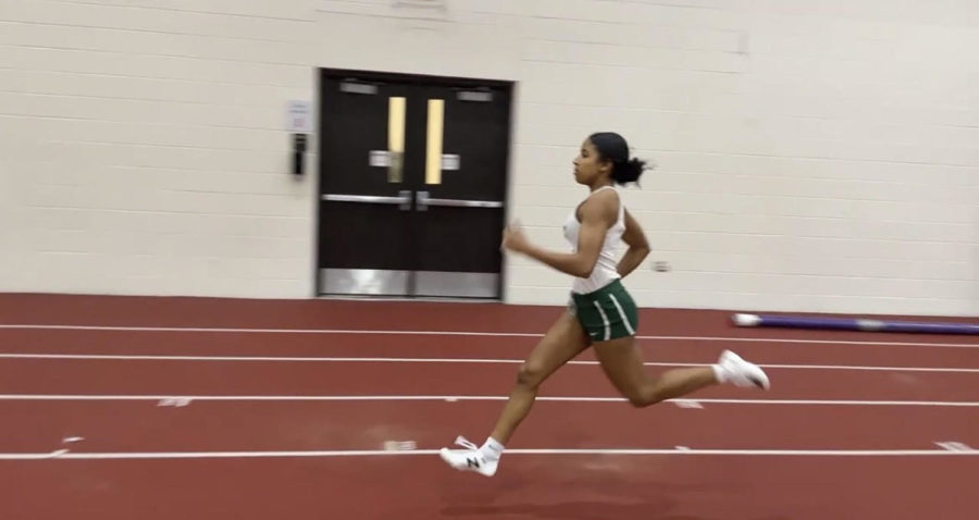 Ashanti LeFlore, senior, runs the 55m race at the Lincoln-Way East meet where she finished in first place. 