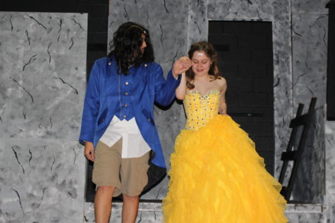 Aiden Mendoz,Senior, (Beast), and Maggie Meagher, Senior(Belle) practice a scene in the play. Show times begin tonight at 6:30 p.m., Saturday at 2 and 6:30 p.m., and Sunday at 2 p.m. 