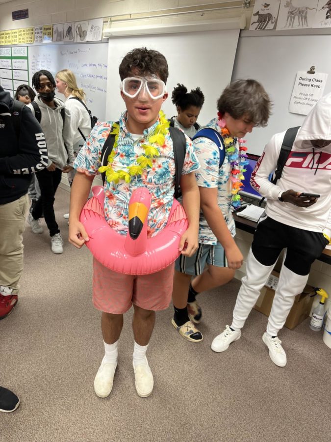 Niko Luciano, sophomore, enjoys beach day with his flamingo.