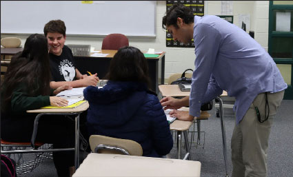Brendan Timmel, science teacher, helps students with schoolwork every Monday, Tuesday, and Thursday as part of the new tutoring sessions. Teachers in other core subjects are also available.