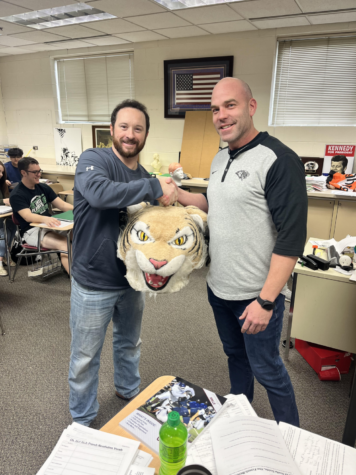Greg Proctor passes the Wildcat Award to Coach Rob Keene.