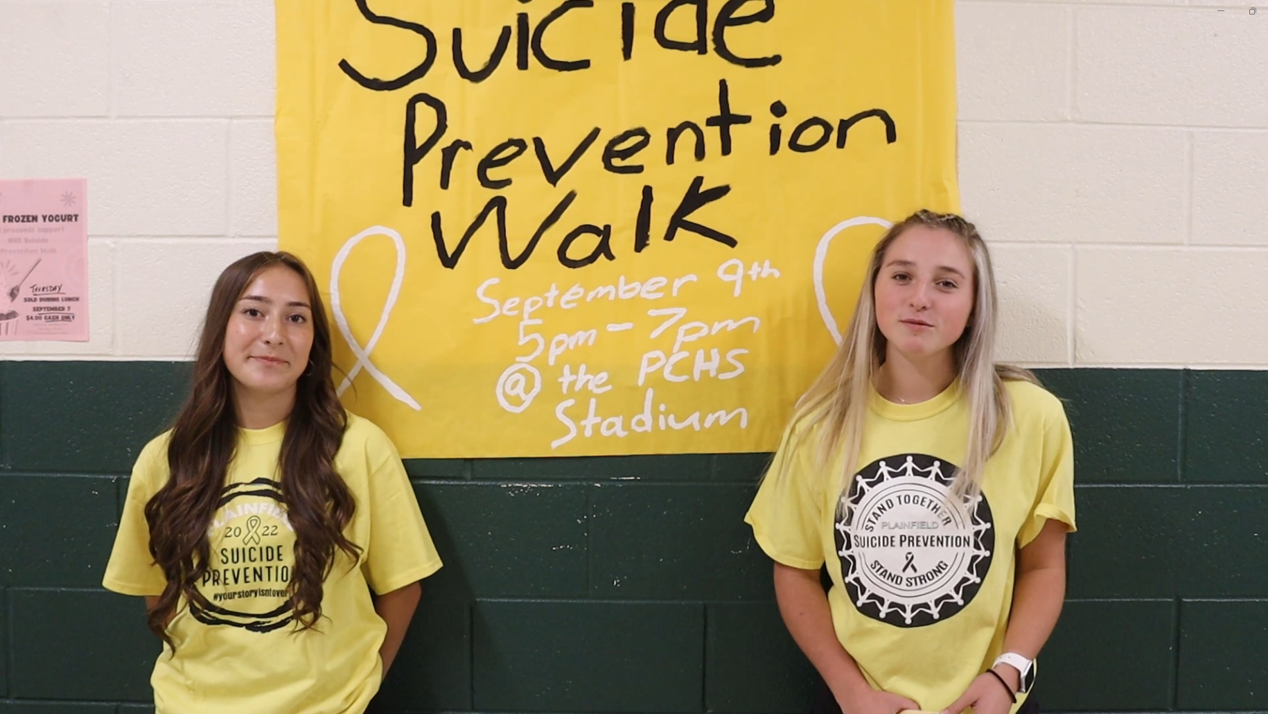Members of National Honors Society give an announcement about the Suicide Prevention Walk.