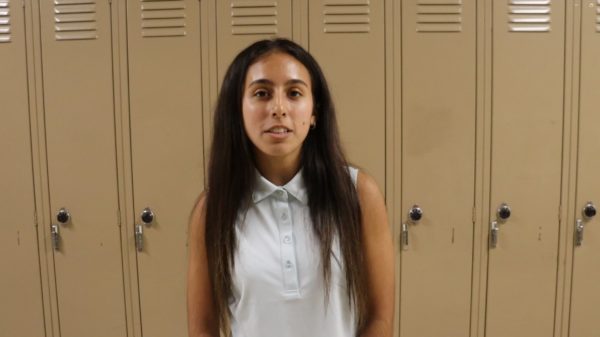 Brooke Plowman gives an announcement relating to Homecoming entry.