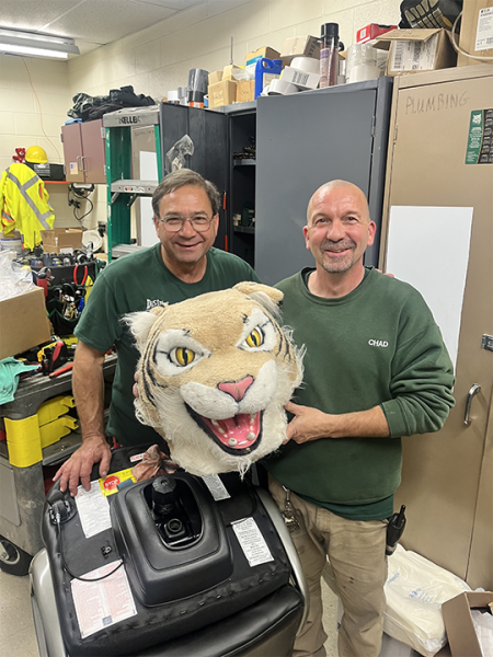 Chad and Paul in maintenance receive the Wildcat Award from the custodial staff.