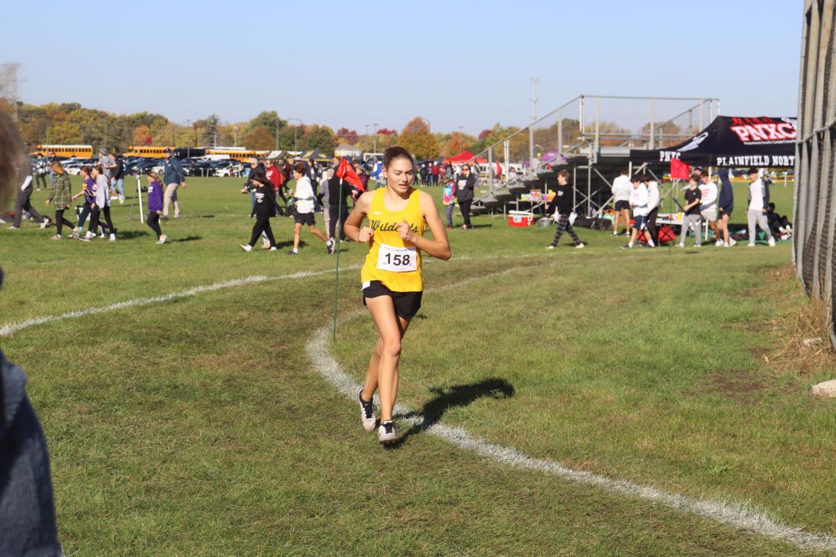 Alexis Pacholski, senior, finishes a strenuous race at regionals.  