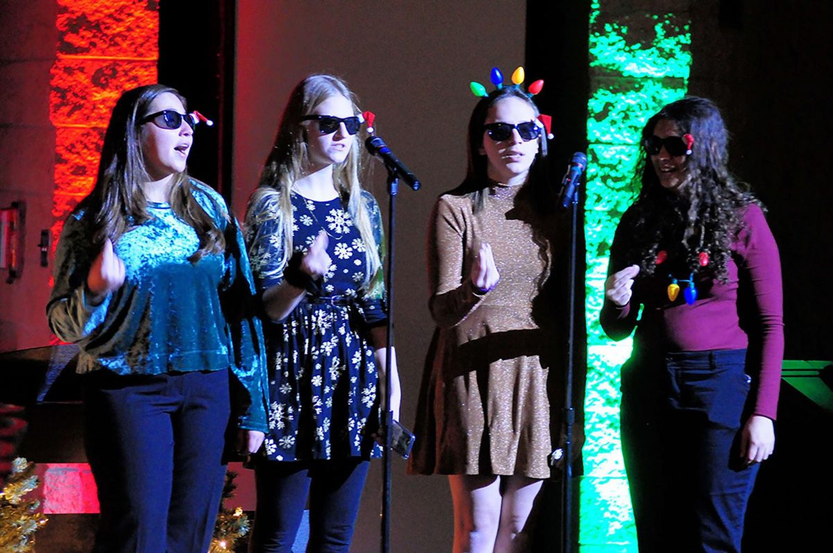 Seniors Sabrina Rodriguez and Becca Cameron perform at last years collage concert with alumni.